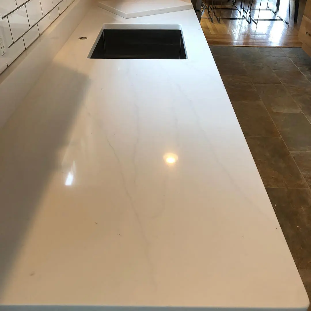 - 3 White marble countertop with black sink