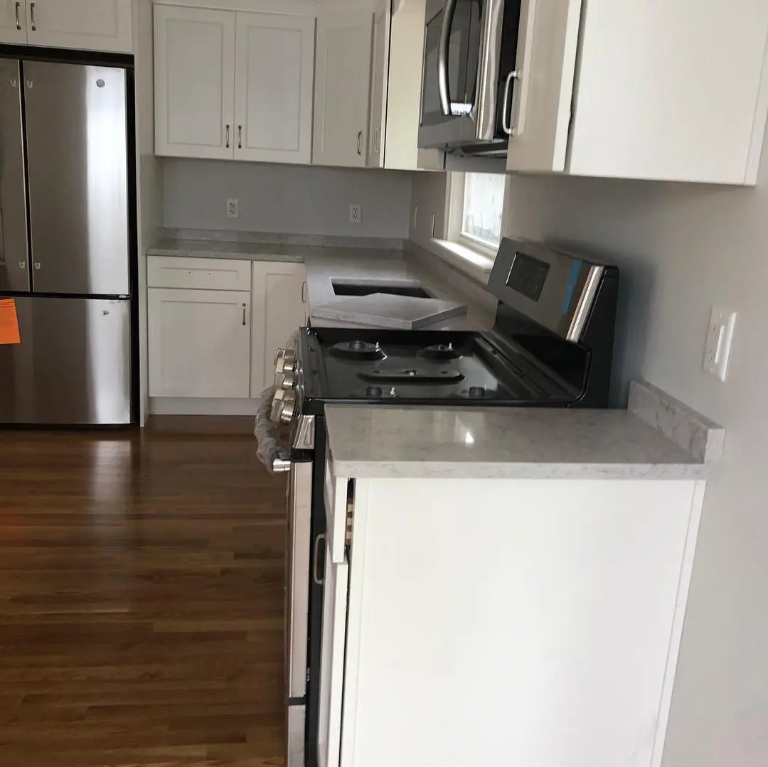 - 5 White granite kitchen countertop with stainless appliances