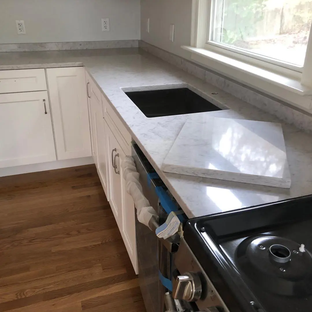 - 2 White marble kitchen countertop with window view