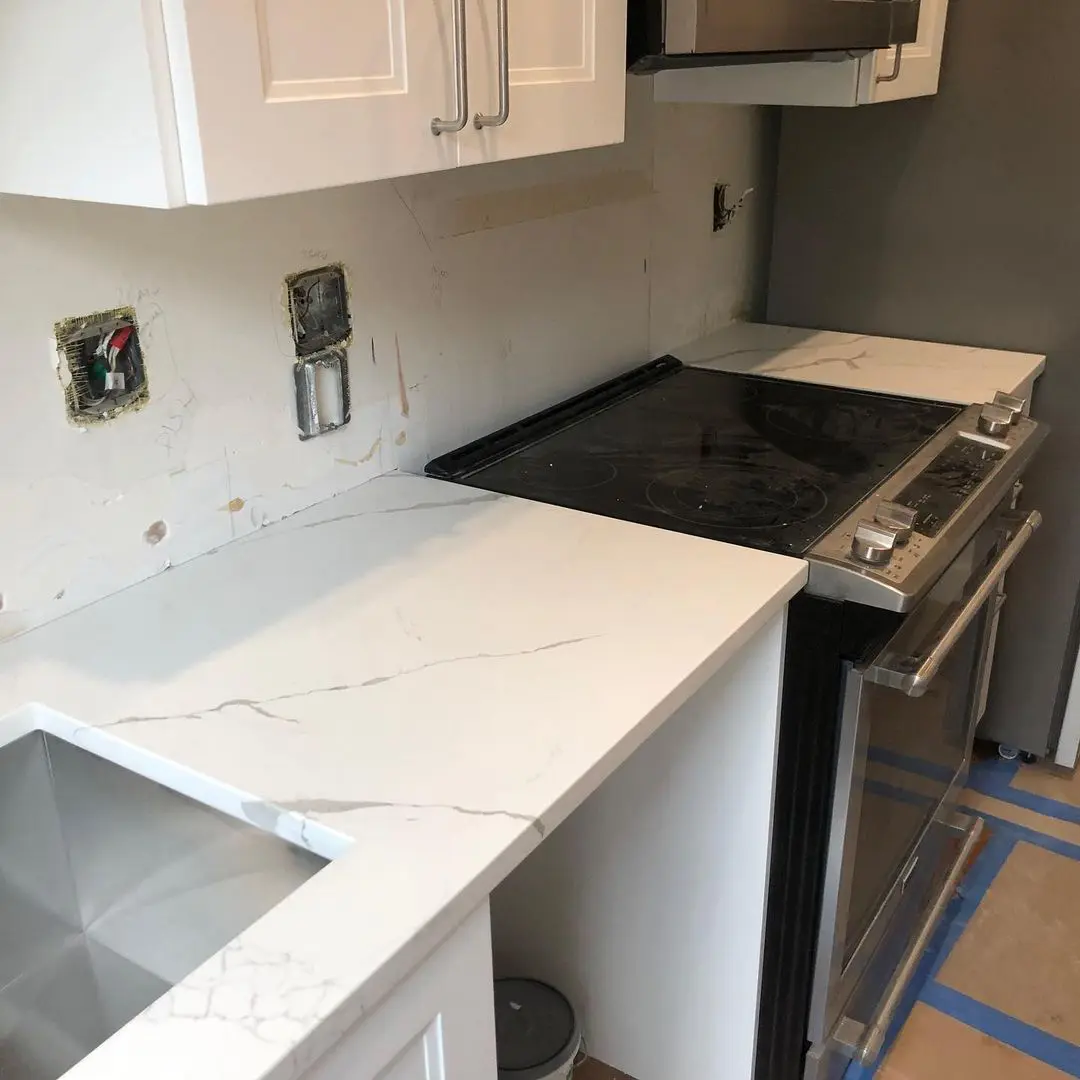- 3 Kitchen countertop with stove and cabinetry
