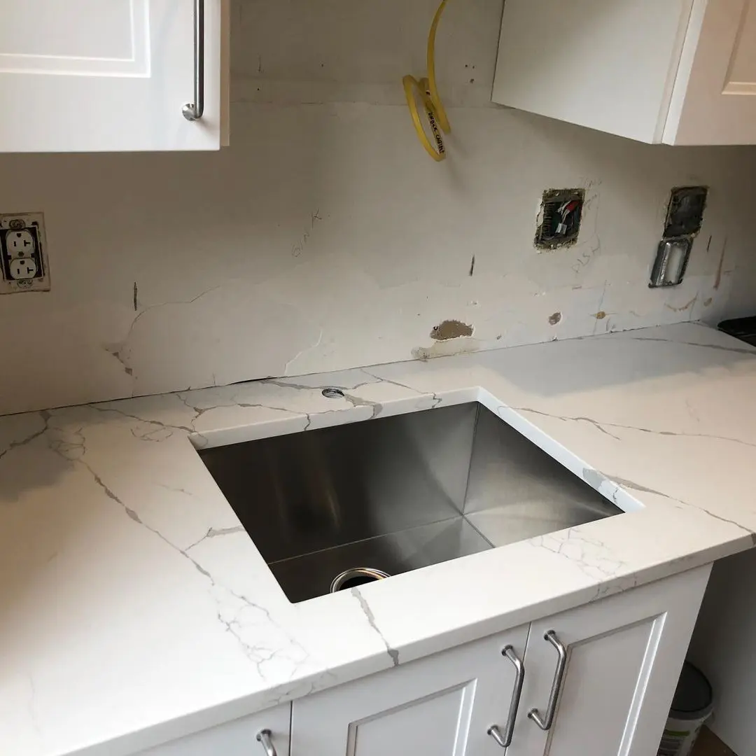 - 2 Modern stainless steel sink with marble countertop