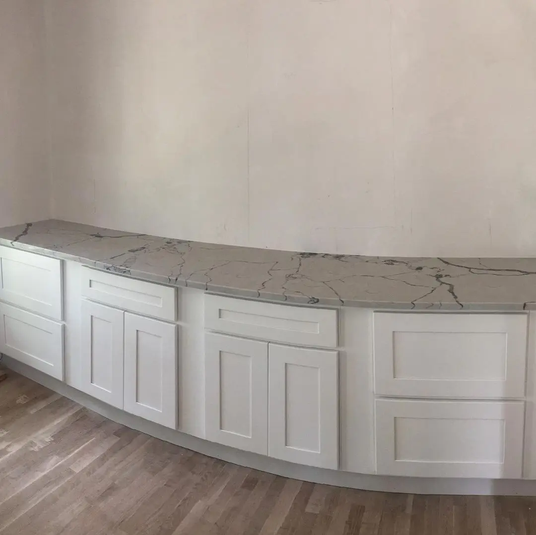 - 2 Polished marble countertop with white cabinetry