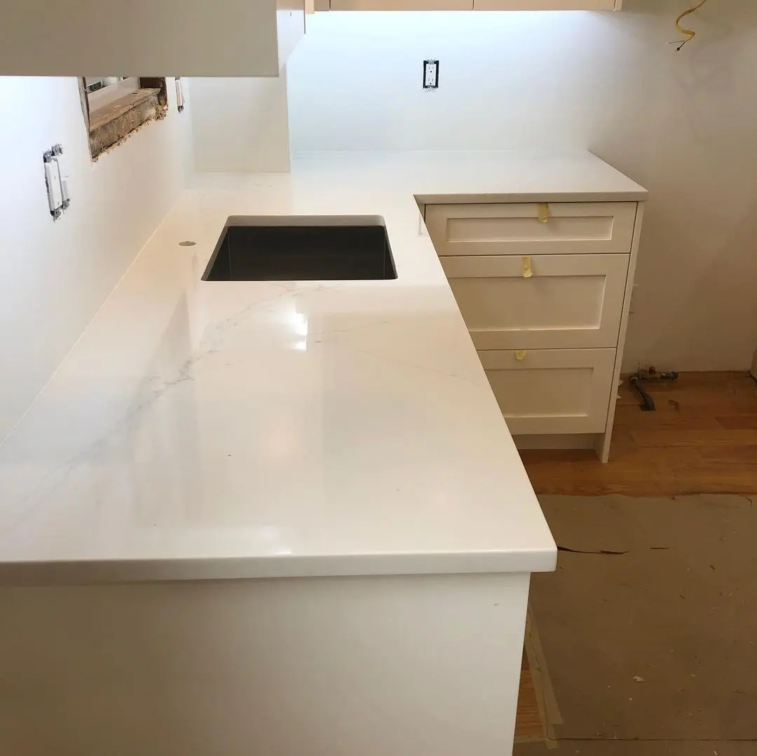 - 5 Marble countertop with black sink and cabinetry
