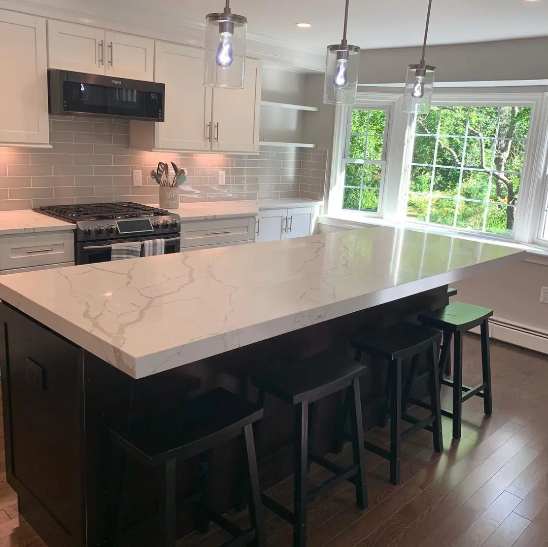 - 2 Modern kitchen with marble countertops and large window