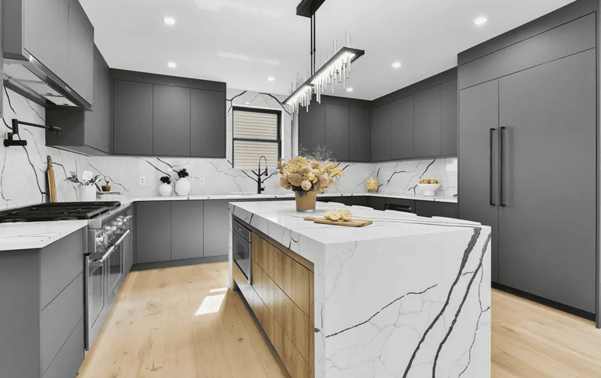 - 1 Elegant modern kitchen with gray cabinets and marble countertops.