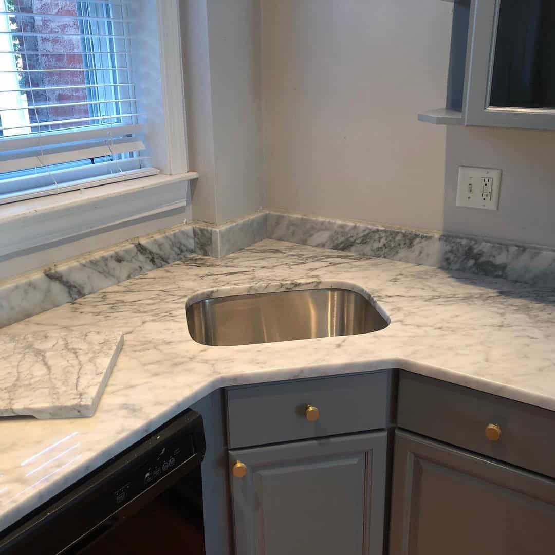 - 3 Carrara marble countertop with undermount sink and marble backsplash