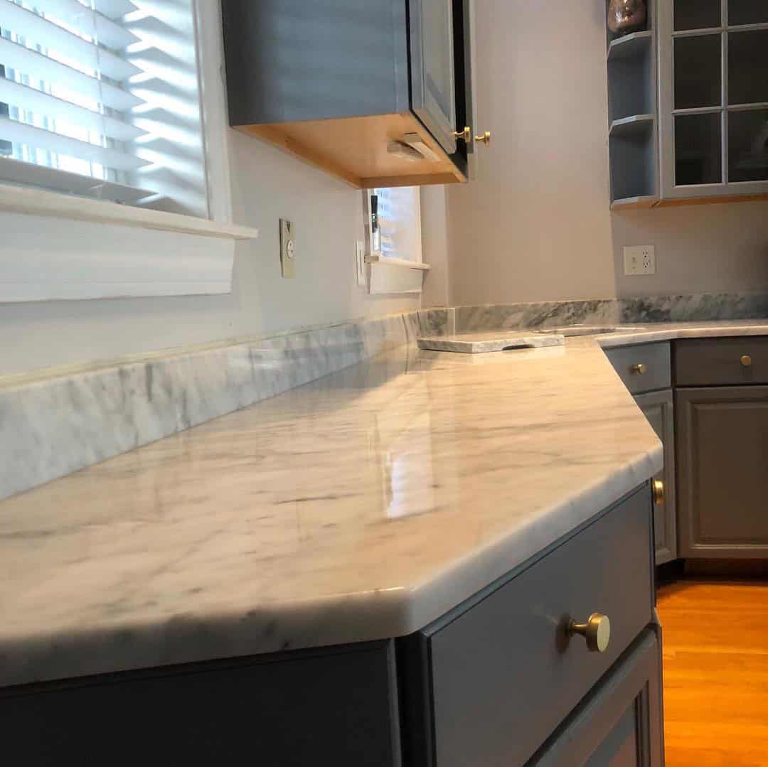 - 3 Polished Carrara marble countertop close-up showing natural gray veining by Pablo Marble and Granite