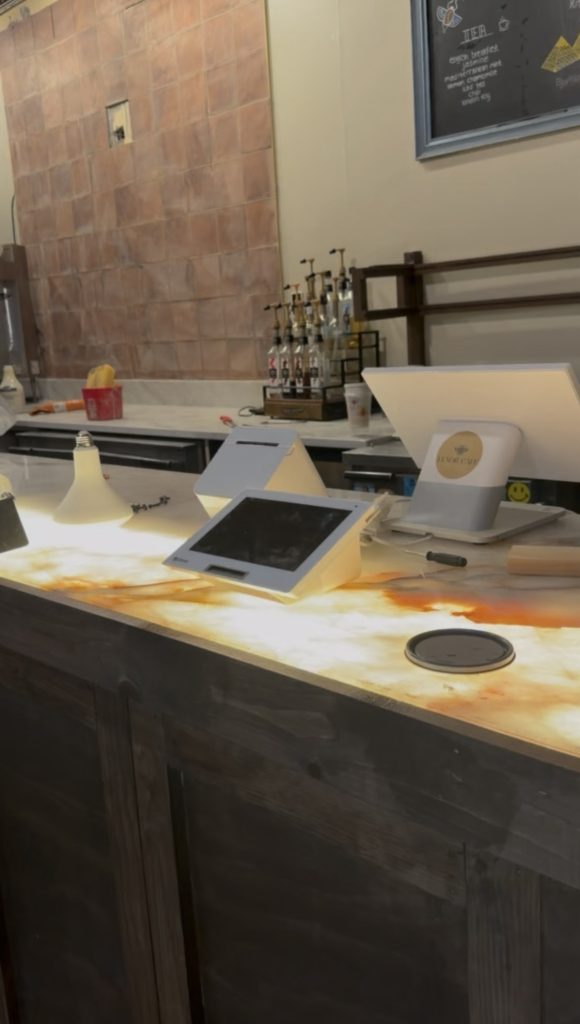 - 4 Finished backlit Patagonia quartzite counter glowing warm amber at Luxor Cafe